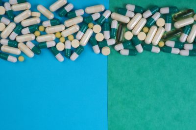 blue green background with pills green blue background - ADV Pharmacy